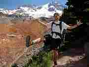 Derek Rowely posing at view point of Emerald Ridge.